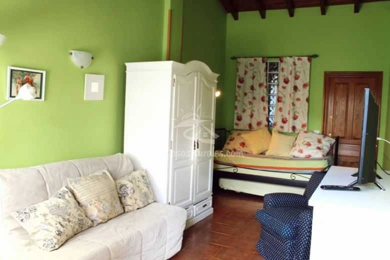 Zona de estar del apartamento · Chalet Turístico Río Cubas