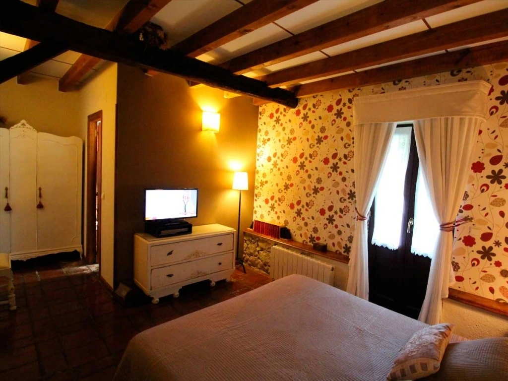 Habitación con zona de estar · Posada La Llosa