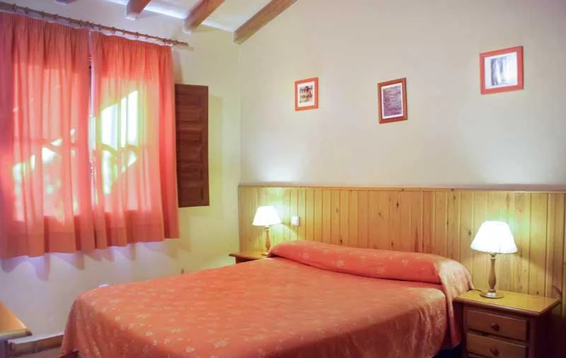 Dormitorio de un apartamento sencillo · El Calambuco