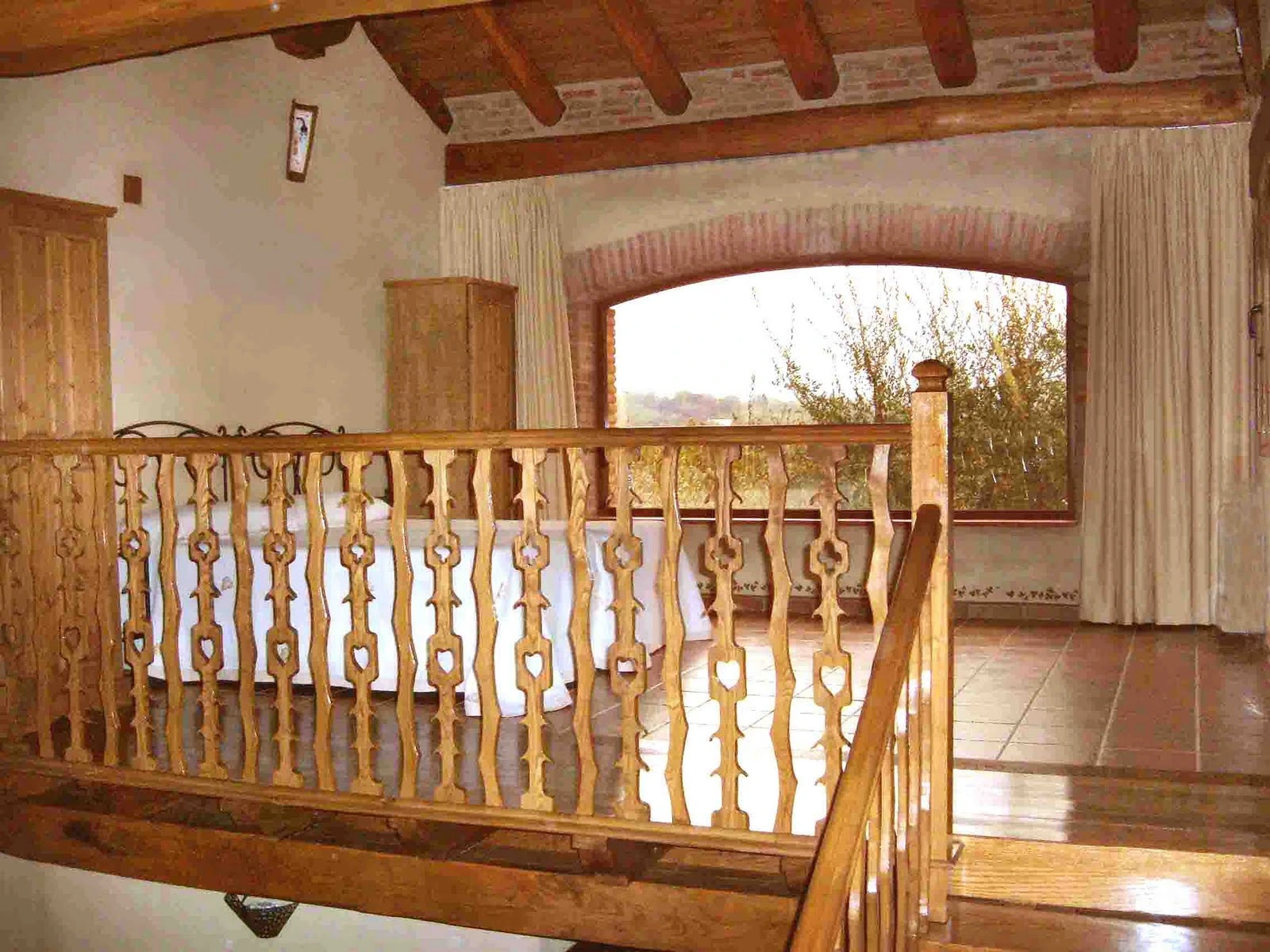 Dormitorio abuhardillado de los apartamentos de La Oropéndola · Apartamentos Rurales La Oropéndola