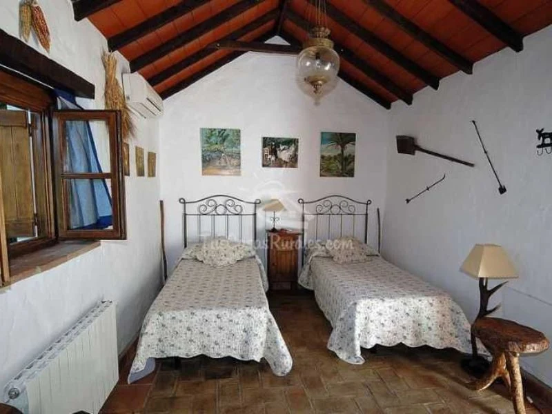 Dormitorio del alojamiento Parque Las Aves con camas individuales