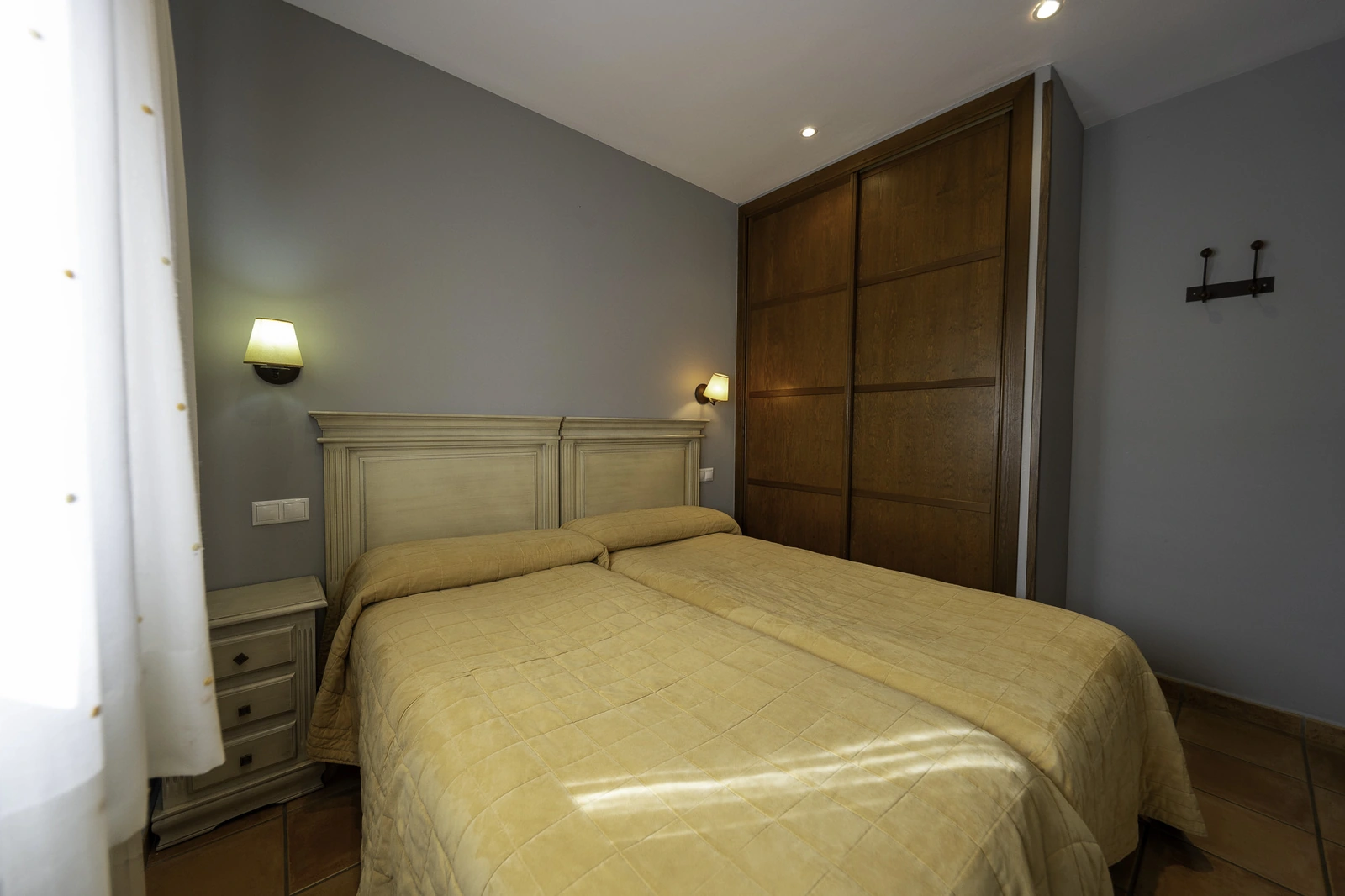 Dormitorio de un apartamento de planta baja · Apartamentos Rurales Miraltajo