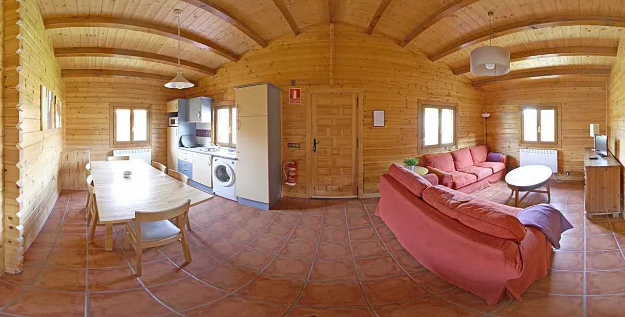 Sala de estar y cocina de una casa de Paraíso Rural