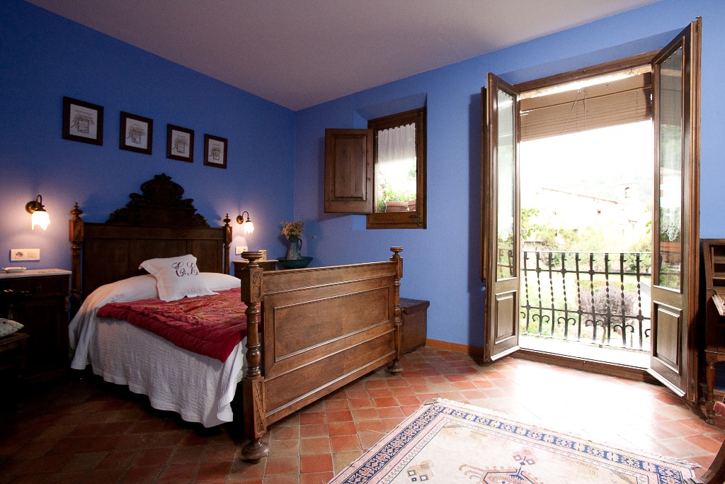 Dormitorio con balcón de Casa Leonardo