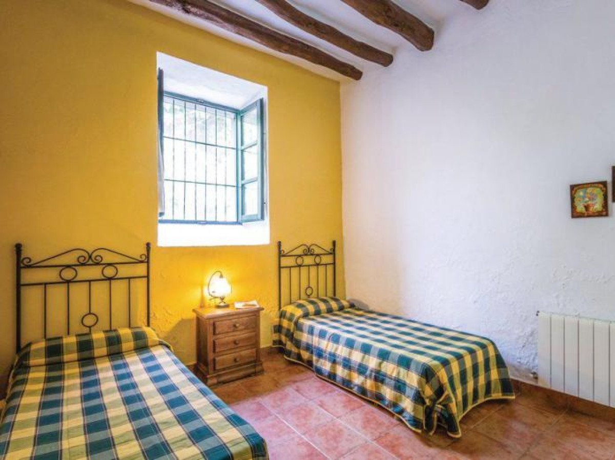 Dormitorio con dos camas de Paraje El Saltadero